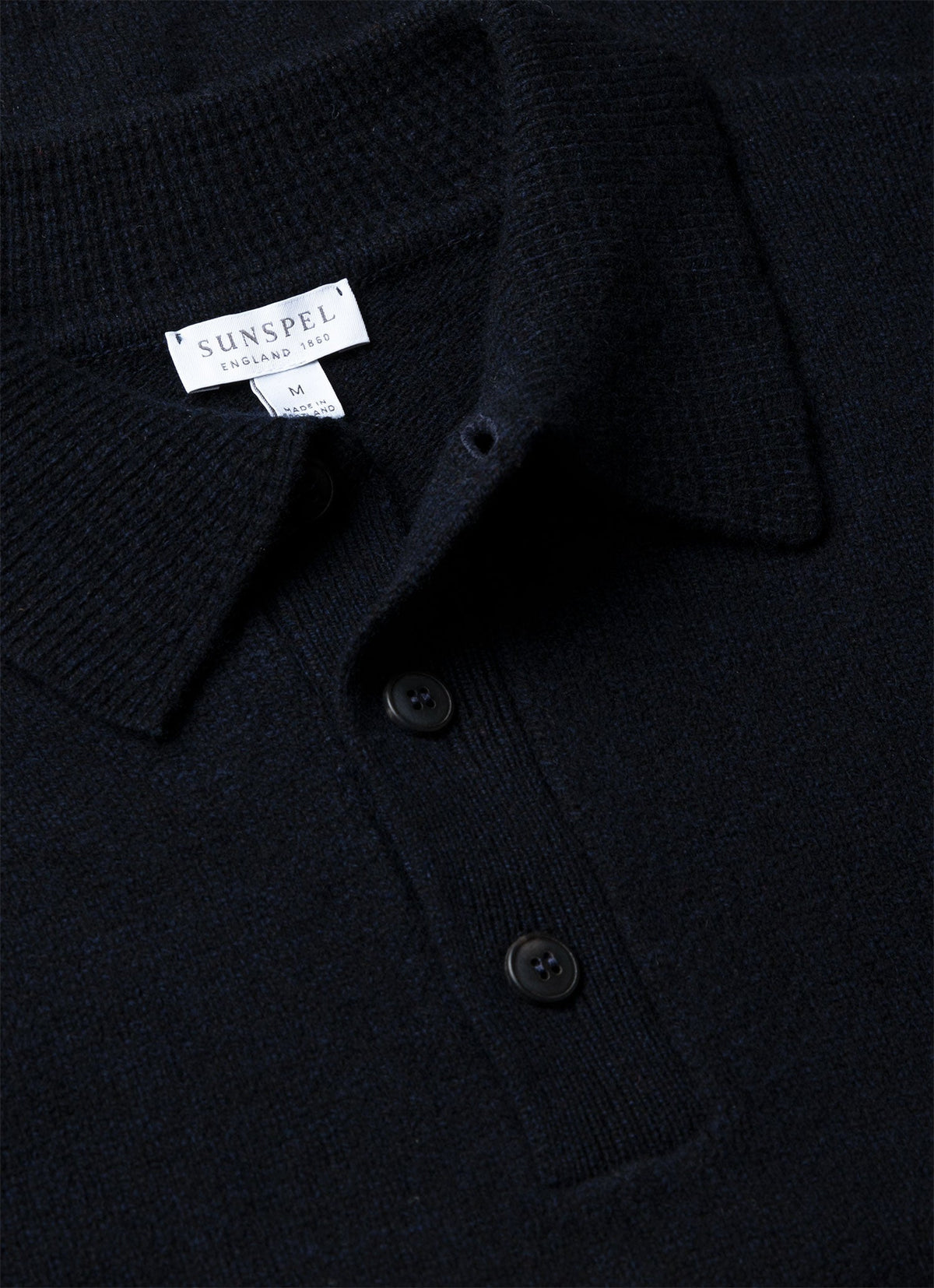 Polo en maille d'agneau mérinos pour homme coloris bleu marine mouliné