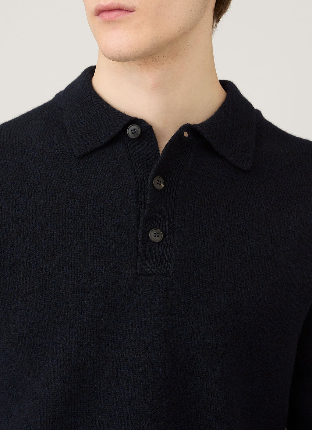 Polo en maille d'agneau mérinos pour homme coloris bleu marine mouliné