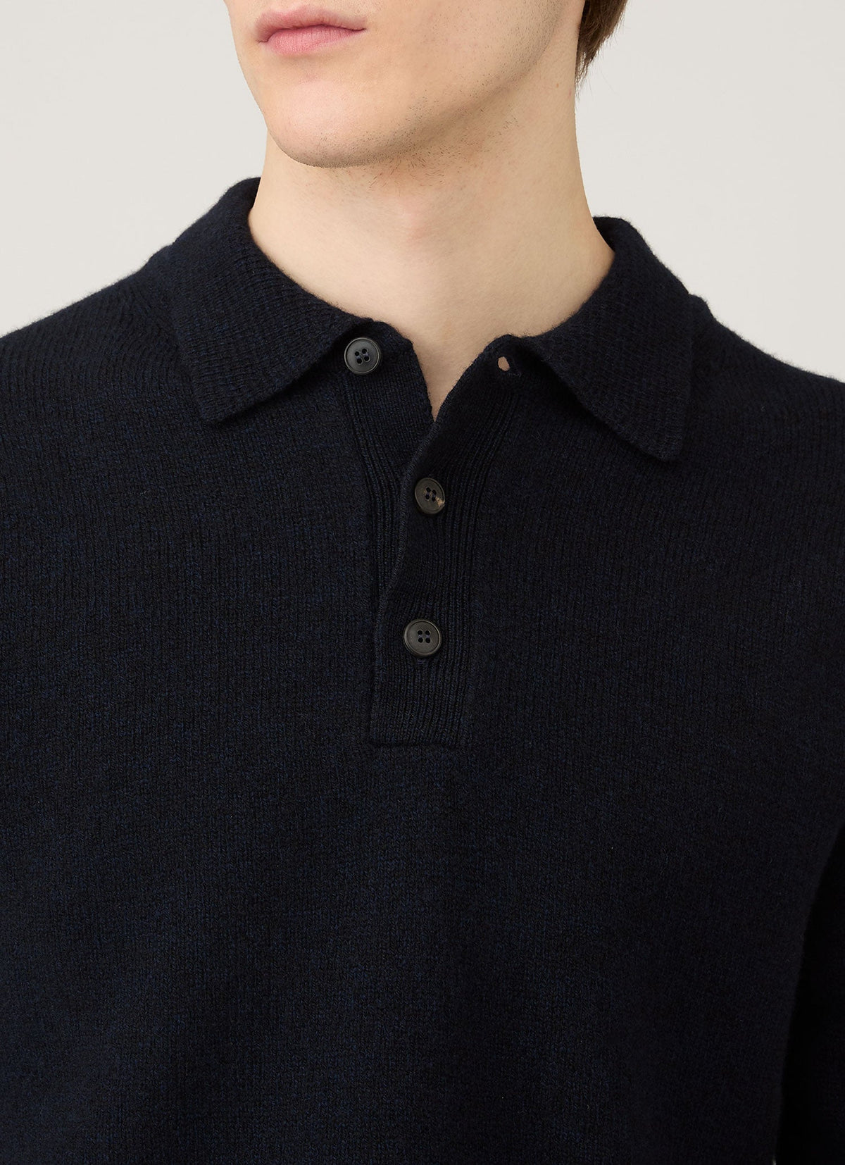 Polo en maille d'agneau mérinos pour homme coloris bleu marine mouliné